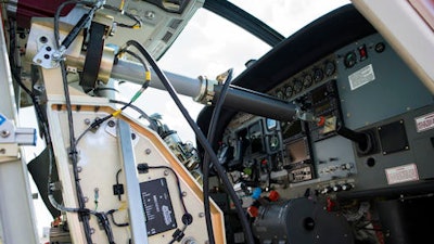 Aurora Flight Sciences' Aircrew Labor In-Cockpit Automantion System (ALIAS), is mounted in the co-pilot seat of a Cessena Caravan aircraft at Manassas Airport in Manassas, Va., Monday, Oct. 17, 2016. Government and industry are working together on a robot-like autopilot system that could eliminate the need for a second human pilot in the cockpit.