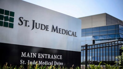 This Wednesday, July 22, 2015, file photo shows St. Jude Medical corporate headquarters, in Little Canada, Minn., just north of St. Paul. Medical device maker St. Jude Medical is warning doctors and patients about a rare battery defect in some of its implantable heart devices that can cause them to fail much earlier than expected.