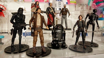 This Thursday, Oct. 6, 2016, photo shows the Star Wars Rogue One Elite Series characters, from The Disney Store, on display at the annual TTPM Holiday Showcase, in New York. Toy companies are offering products that are more inclusive, from Barbie dolls in all shapes, sizes and skin tones to baby dolls aimed at boys. Toy companies are also offering dolls that represent different disabilities. But still experts and parents say more work needs to be done.