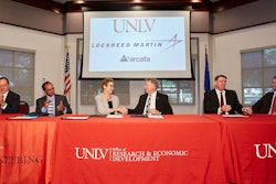 Diane Chase, UNLV Executive Vice President and Provost, shakes hands after signing agreement with Scott Jones, director of civil space supply chain management at Lockheed Martin.