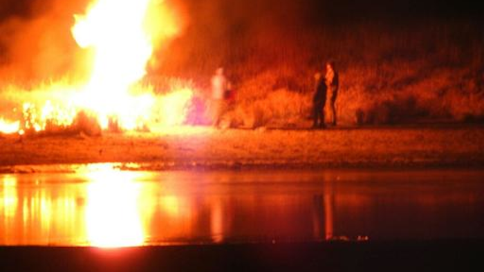 Law enforcement and protesters clash near the site of the Dakota Access pipeline on Sunday, Nov. 20, 2016, in Cannon Ball, N.D. The clash came as protesters sought to push past a bridge on a state highway that had been blockaded since late October, according to the Morton County Sheriff's Office.