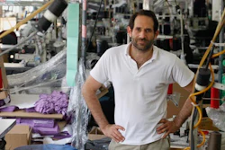 In this April 3, 2012, file photo, Dov Charney, founder of American Apparel, poses for photos at the company's factory in downtown Los Angeles. American Apparel announced Monday, Nov. 14, 2016, that the company is filing for bankruptcy protection for the second time in just over a year, unable to find its footing after a contentious fight for control with founder Charney.