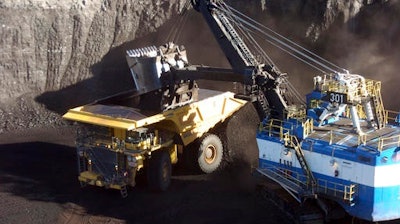 In this Nov. 15, 2016 photo, a mechanized shovel loads coal from an 80-feet thick seam into a haul truck at Cloud Peak Energy's Spring Creek mine near Decker, Mont. Coal from the mine is shipped to power plants for generating electricity. President-elect Donald Trump's vow to revive coal country is met with measured hope in Appalachia and even out West, where mines stand to gain the most.