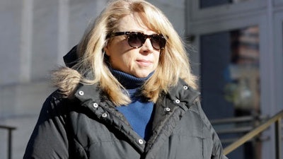 Diane Backis leaves the federal courthouse on Monday, Nov. 28, 2016, in Albany, N.Y. Backis, an accountant, pleaded guilty Monday to mail fraud and filing a false income tax return.