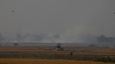 In this Friday, Nov. 4, 2016 photo, a farming field is set on fire to prepare it for its next yield at Jewar, in the state of Haryana, south of New Delhi, India. Even as the Indian capital hit a new low on air pollution, many of the problems that turn Delhi's air so toxic continue unabated, like farmers in bordering regions continuing to burn crop waste.