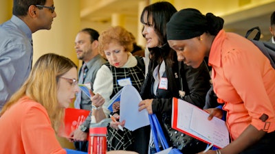 In this file photo, job seekers attend the New York Department of Citywide Administrative Services job fair, in New York.