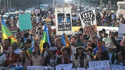 Hundreds protest against climate change and urge world leaders to take action, in a march coinciding with the Climate Conference, known as COP22, taking place in Marrakech, Morocco, Sunday, Nov. 13, 2016.