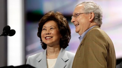 In this July 17, 2016 file photo, former Labor Secretary Elaine Chao and her husband, Senate Majority Leader Mitch McConnell, R-Ky., check out the stage during preparation for the Republican National Convention inside Quicken Loans Arena in Cleveland. President-elect Donald Trump has picked Elaine Chao to become transportation secretary, according to a Trump source.