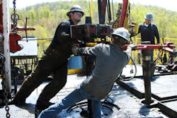 In this April 23, 2010 photo, workers move a section of well casing into place at a Chesapeake Energy natural gas well site near Burlington, Pa., in Bradford County. President-elect Donald Trump has not minced words about his approach to environment and energy policy: He loathes regulation, and wants to increase the use of coal, offshore drilling and fracking.
