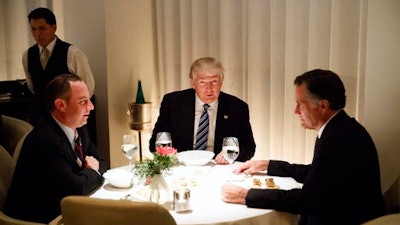 President-elect Donald Trump, center, eats dinner with Mitt Romney, right, and Trump Chief of Staff Reince Priebus at Jean-Georges restaurant, Tuesday, Nov. 29, 2016, in New York.
