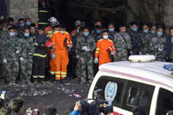 In this Tuesday, Nov. 1, 2016 photo released by Xinhua News Agency, rescuers mourn for victims at Jinshangou Coal Mine in Chongqing, southwest China. All the coal miners trapped underground in a gas explosion earlier this week have been found dead, state media reported Wednesday, as work safety officials vowed to punish those responsible.