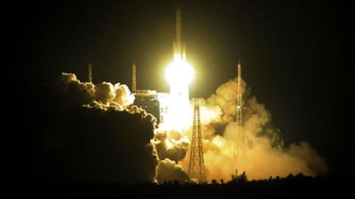 In this photo taken Thursday Nov. 3, 2016, a CZ-5 heavy-lift rocket, the latest in China's Long March series, blasts off from the Wenchang Satellite Launch Center in Wenchang county in south China's Hainan province. China says its plans for a permanent space station remain on track with the successful launch of its new heavy-lift Long March 5 rocket.