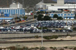 In this Nov. 21, 2013, file photo, cars sit at the General Motors plant where Chevrolet Sonics, Cadillac SRXs and Captiva SUVs are assembled in Ramos Arizpe, Mexico. U.S. President-elect Donald Trump’s election could bring some upheaval to the U.S. auto industry, which helped to lead the nation out of the Great Recession as U.S. sales rebounded. The industry is waiting to see if Trump will make good on promises to redo trade agreements and slap tariffs on cars manufactured in Mexico.