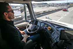 In this Thursday, Aug. 18, 2016, file photo, Matt Grigsby, senior program engineer at Otto, takes his hands off the steering wheel of a self-driving, big-rig truck during a demonstration on the highway, in San Francisco. Uber's self-driving startup Otto developed technology allowing big rigs to drive themselves. After taking millions of factory jobs, robots could be coming for a new class of worker: people who drive for a living.