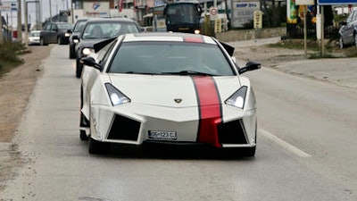 Kosovo car enthusiast Driton Selmani drives his hand made replica Lamborghini thorough the town of Gjilan in Kosovo on Thursday, Oct. 27, 2016. Selmani always wanted some hot wheels but could not afford them. What he had, however, was a workshop and talent for bending and welding metal. so he built himself a Lamborghini.