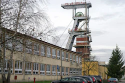 A view of the entrance to the Rudna copper mine with a miners flag at half-staff, in Polkowice, Poland, Wednesday, Nov. 30, 2016. The mine was hit by a tremor and cave-in, killing five miners and three are missing.