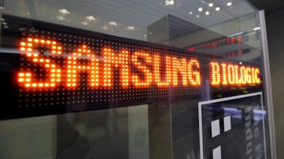 A name of Samsung Biologics Co. is displayed at the Korea Exchange in Seoul, South Korea, Thursday, Nov. 10, 2016. Samsung Biologics Co., the contract drug making unit of Samsung Group, made its market debut in Seoul on Thursday in South Korea's largest initial public offering in six years.