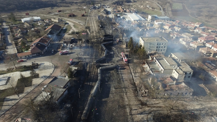 In this aerial view emergency services attend the scene of devastation after a tanker train derailed and a gas tank exploded in the village of Hitrino, northeastern Bulgaria, early Saturday, Dec. 10, 2016.