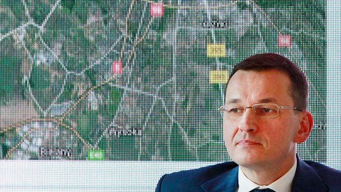 Poland's Deputy Prime Minister for economy, Mateusz Morawiecki announces Monday, Dec. 5, 2016 during a news conference in Warsaw, Poland, a major joint investment of some 250 million euros by Lufthansa and General Electric to build an advanced plant in southwestern Poland that will service engines for the Boeing 747-8 jumbo jets, starting in Sept. 2018.
