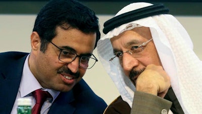 Mohammed Bin Saleh Al-Sada, Minister of Energy and Industry of Qatar and President of the OPEC Conference, left, and Khalid Al-Falih, Minister of Energy, Industry and Mineral Resources of Saudi Arabia attend a news conference after a meeting of the Organization of the Petroleum Exporting Countries, OPEC, at their headquarters in Vienna, Austria, Saturday, Dec. 10, 2016.