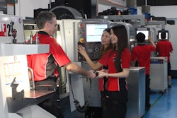 Gordon Styles (left) working with two Star Prototype employees on a Haas VF-2SS CNC.