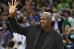 In this Oct. 11, 2015 file photo, NBA basketball legend Michael Jordan waves during the match of Charlotte Hornets against the Los Angeles Clippers at the 2015 NBA Global Games in Shenzhen, south China's Guangdong province. China's highest court ruled Thursday, Dec. 8, 2016, in favor of Jordan at the conclusion of a years-long trademark case. The former NBA star has been in dispute with a sportswear company based in southern China called Qiaodan Sports since 2012.