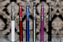 E-cigarettes appear on display at Vape store in Chicago. U.S. Sen. Charles Schumer is increasing the heat on the federal government to consider recalling e-cigarette batteries and devices that explode and catch fire, injuring users.