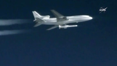 This still image taken from video provided by NASA shows a Pegasus rocket containing eight mini-satellites launching from a plane 39,000 feet above the Atlantic, 100 miles east of Daytona Beach.