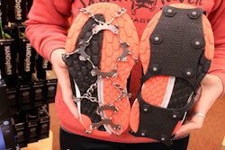 Emma Bohman, a sales associate at Skinny Raven sporting goods, shows two kinds of exterior cleats attached to running shoes in Anchorage, Alaska. Exterior cleats are one of many ways Anchorage residents cope with up ice on streets up to seven months per year.