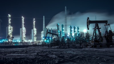 Oil Rigs And Brightly Lit Industrial Site At Night 510477582 4256x2832 58403e05da5f0