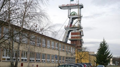 A view of the entrance to the Rudna copper mine with a miners flag at half-staff, in Polkowice, Poland.