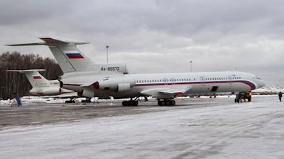 This photo taken on Thursday, Jan. 15, 2015 shows the Tu-154 plane with registration number RA-85572, foreground, at Chkalovsky military airport near Moscow, Russia. A Russian plane with 92 people aboard, including a well-known military band, crashed into the Black Sea on its way to Syria on Sunday, Dec. 25, 2016, minutes after takeoff from the resort city of Sochi, the Defense Ministry said. The Tu-154, the same plane shown in this photo, which belonged to the Defense Ministry, was taking the Alexandrov Ensemble to a concert at the Russian air base in Syria.