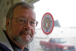 Bill Davis, of Gas City, Ind., poses in his union's meeting hall in Huntington, Ind., Tuesday, Dec. 6, 2016. Davis works at the United Technologies Electronic Controls factory in Huntington where workers are working mostly seven days a week since late October, making control panels for the furnace, air conditioning and refrigeration industries. Leaders of their union believe the company is doing so ahead of the factory's layoffs expected to start in April and continue into 2018.