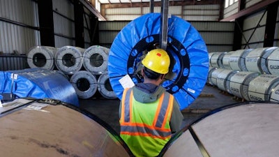 A worker uses a lift to move rolls of sheet metal at LMS International, in Laredo, Texas. Donald Trump’s campaign promise to abandon the North American Free Trade Agreement helped win over Rust Belt voters who felt left behind by globalization. But U.S. border cities that have thrived under the trade pact now worry that an economic reckoning could be coming its way.