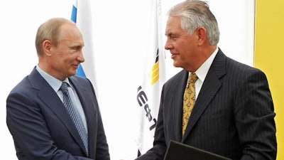 In this June 15, 2012, file photo, Russian President Vladimir Putin, left, and ExxonMobil CEO Rex Tillerson shake hands at a signing ceremony of an agreement between state-controlled Russian oil company Rosneft and ExxonMobil at the Black Sea port of Tuapse, southern Russia. President-elect Donald Trump selected Tillerson to lead the State Department on Monday, Dec. 12, 2016.