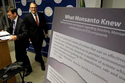 Washington Attorney General Bob Ferguson, left, and Gov. Jay Inslee head into a news conference where Ferguson announced a lawsuit against agrochemical giant Monsanto over pollution from PCBs, Thursday, Dec. 8, 2016, in Seattle. Washington says it's the first U.S. state to sue Monsanto over pollution from PCBs. The chemicals, polychlorinated biphenyls, were used in many industrial and commercial applications, including in paint, coolants, sealants and hydraulic fluids. PCB contamination impairs rivers, lakes and bays around the country.
