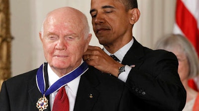 In this Tuesday, May 29, 2012, file photo, President Barack Obama awards the Medal of Freedom to former astronaut John Glenn during a ceremony in the East Room of the White House in Washington.