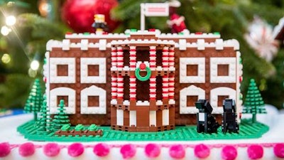 In this Tuesday, Nov. 29, 2016 file photo a LEGO model of the White House, one of fifty-six LEGO gingerbread houses, one for each state and territory, is displayed in the trees in the State Dinning Room at the White House during a preview of the 2016 holiday decor, in Washington. White House holiday displays were created this year by Lego's master builders, a team of seven at the company's US headquarters in Enfield, Conn., who devote hours and tens of thousands of toy bricks to projects that go on display around the world.