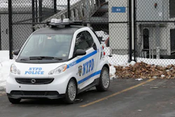 In this Feb. 12, 2015 file photo, A New York City Police Department Smart car is parked in the parking lot of Central Park's precinct in New York. The NYPD plans to replace its three-wheeled scooters with Smart cars. NYPD has announced plans to expand its fleet of Smart cars, Thursday, Dec. 1, 2016, to replace the three-wheeled scooters that officers utilized for decades.