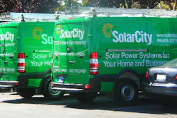In this October 2009 photo, a pair of SolarCity Dodge Sprinters are parked outside the SolarCity headquarters in Foster City, California.