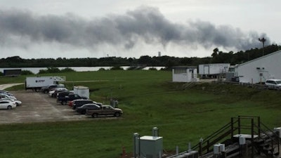 Smoke rises from a SpaceX launch site on Thursday, Sept. 1, 2016, at Cape Canaveral, Fla. NASA said SpaceX was conducting a test firing of its unmanned rocket when a blast occurred.