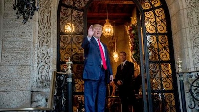 President-elect Donald Trump waves to members of the media after a meeting with admirals and generals from the Pentagon at Mar-a-Lago, in Palm Beach, Fla., Wednesday, Dec. 21, 2016.