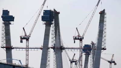In this Nov. 2, 2016, file photo, construction on the new Tappan Zee Bridge rises above the current bridge as seen from Tarrytown, N.Y. Even as they maneuver for a share of the $1 trillion in spending President-elect Donald Trump promised to rebuild America’s roads, bridges and airports, lobbyists for transportation and utility industries are beginning to wonder whether Trump really meant what he said. From the day he formally entered the presidential race to the moment he declared victory, Trump pledged to rebuild the nation’s aging and inadequate infrastructure.