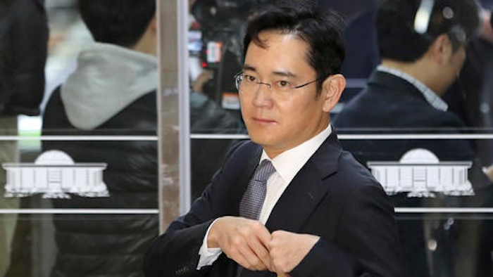 In this Tuesday, Dec, 6, 2016, file photo, Lee Jae-yong, a vice chairman of Samsung Electronics Co., arrives for a hearing at the National Assembly in Seoul, South Korea. South Korean authorities say a Samsung scion will be questioned as a suspect in a bribery case in the massive influence-peddling scandal that led to the president's impeachment.