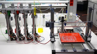 This is a prototype for a 3D bioprinter that can create totally functional human skin.