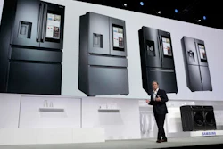 John Herrington, senior vice president of Samsung Electronics America, unveils new refrigerators with Family Hub 2.0 during a Samsung news conference before CES International, Wednesday, Jan. 4, 2017, in Las Vegas. Family Hub 2.0 features an interface on the refrigerator with apps that can be controlled by voice recognition.