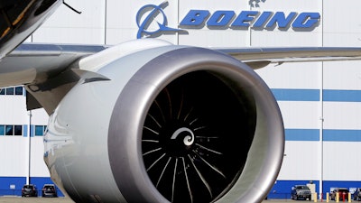 In this file photo, an engine and part of a wing from the 100th 787 Dreamliner to be built at Boeing's North Charleston, S.C., facility are seen outside the plant.
