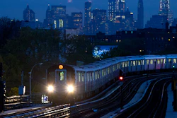 In this file photo, a No. 7 subway train rides the rails in the Queens borough of New York, with the Manhattan skyline in the background.