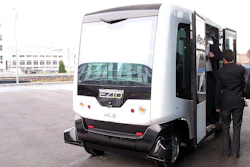 The Ligier EZ-10 autonomous electric mini-shuttle is demonstrated in front of the EPFL Conference Center in Switzerland.