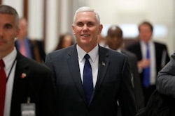 Vice President-elect Mike Pence walks through the halls of Russell Senate Office Building on Capitol Hill in Washington, Tuesday, Jan. 17, 2017.